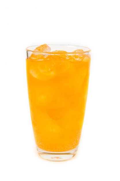 Drink of orange soda with ice in glass on white background