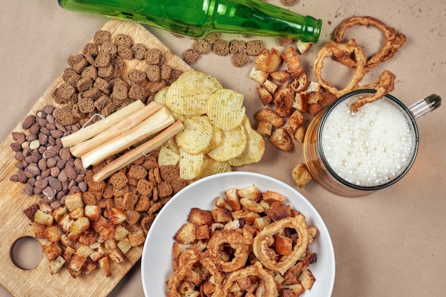 Drinking beer. Table full of beer snacks