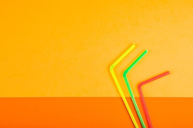 Drinking straws for colored background. Colorful plastic straws used for drinking water or soft drinks.