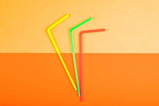 Photo drinking straws for colored background colorful plastic straws used for drinking water or soft drinks