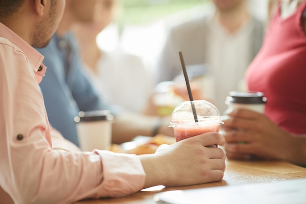 Drinking sweet beverage with friends