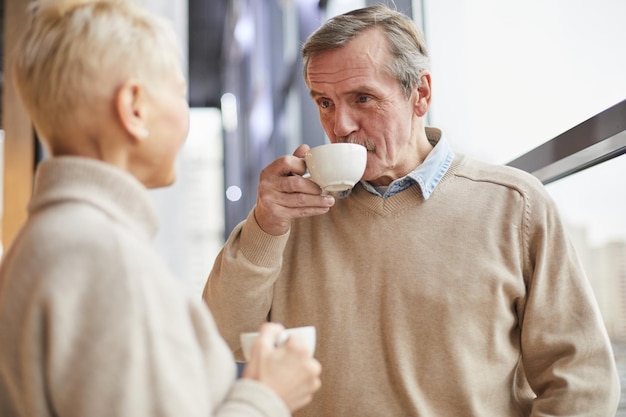 Drinking tea with woman