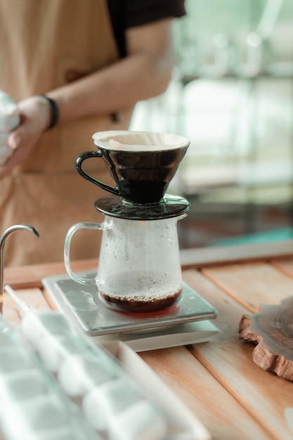 drip coffee maker set on wooden tables