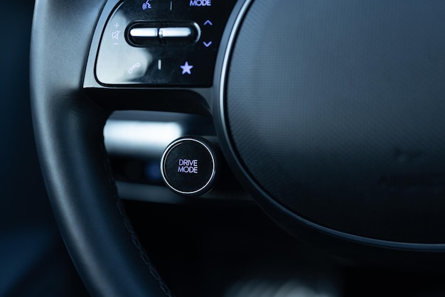 Drive mode button on electric car Relaxed and fuel efficient driving mode saving button DRIVIE MODE