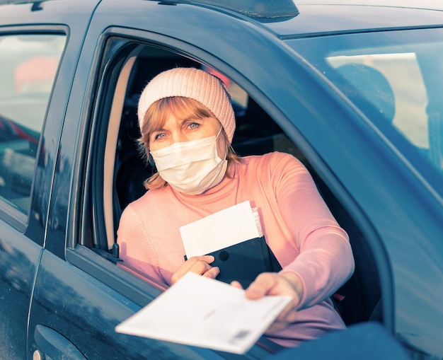 The driver of the car in the mashie during coronavirus covid19