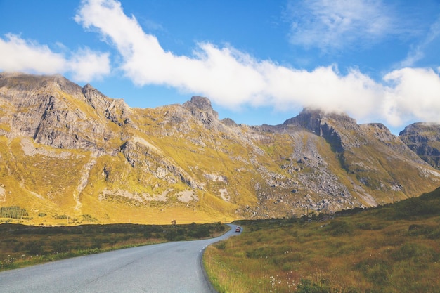 Driving a car on a mountain road in Lofoten islands view from the windscreen Norway Europe