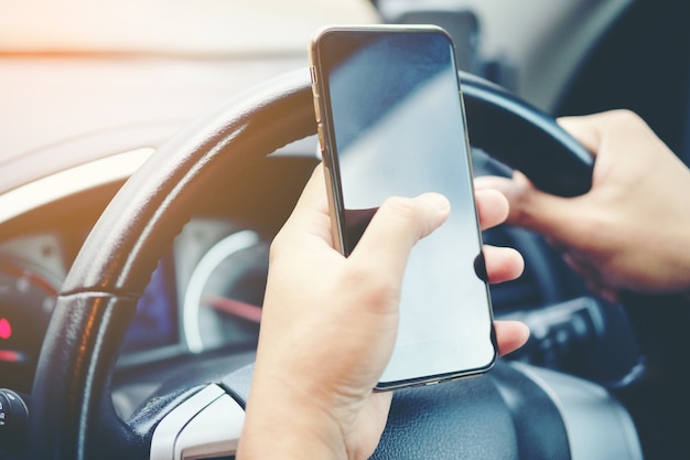 Driving while holding a mobile phone to work 