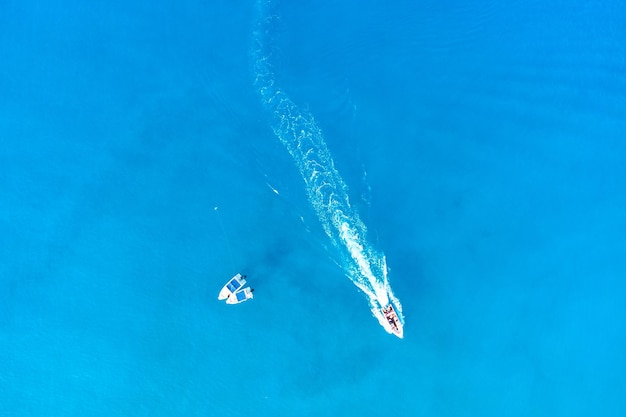 Drone aerial photo of boats in open mediterranean turquoise azure sea Top view