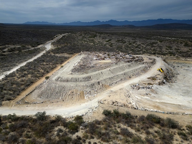 Drone Aerial top view large garbage pile Garbage pile in trash dump or landfill mountain garbage