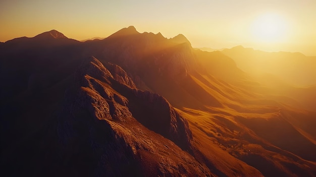 Photo a drone captures the breathtaking scene of a mountain range bathed in the golden light of sunrise