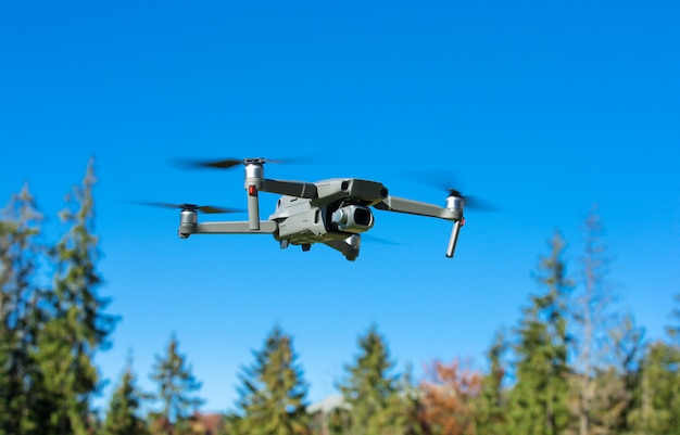 The drone copter flying with digital camera.