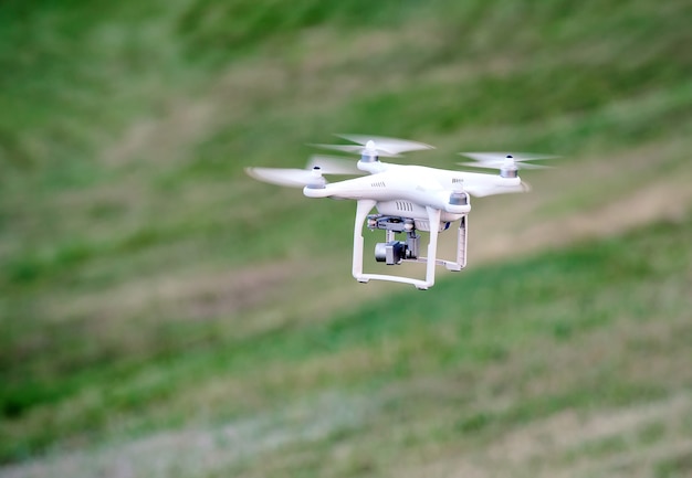 Drone landing on green grass