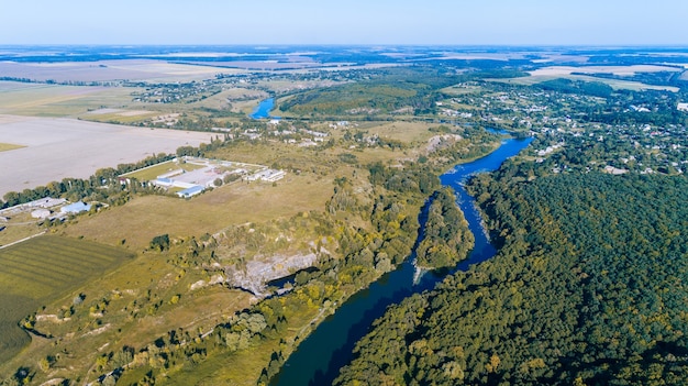 Drone with a camera, beautiful summer small river from a height