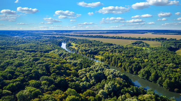 Drone with a camera, beautiful summer small river from a height