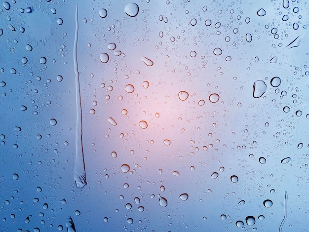 Droplet of water on car mirror, traffic jam