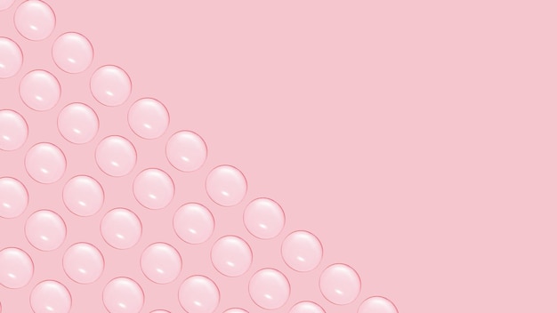 Drops of clear gel or water in rows On a pink background