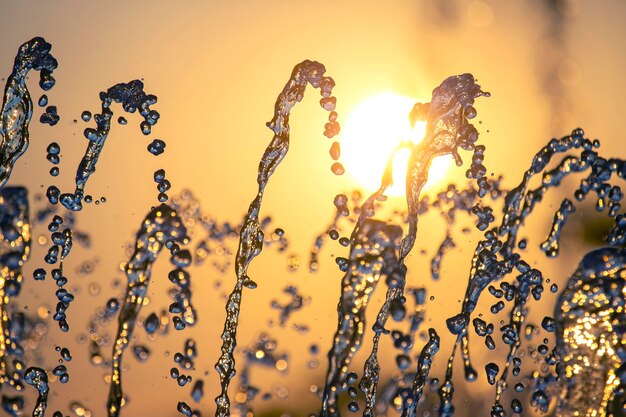 Drops of the fountain in the setting sun