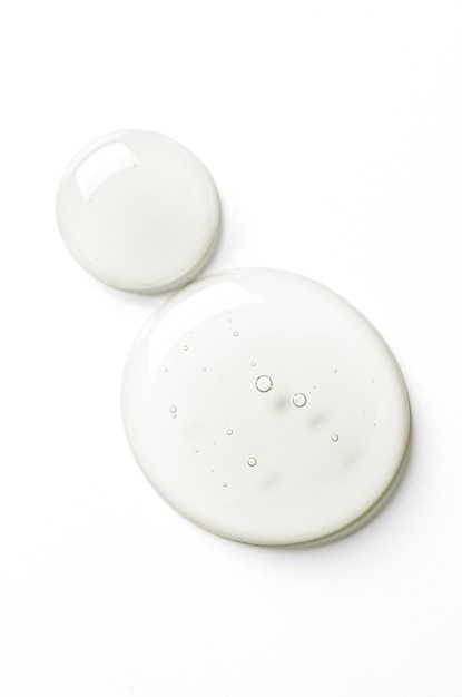 Drops of moisturizing gel or serum on a white background Cosmetic product for skin care