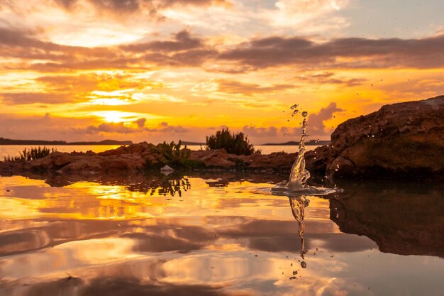 Drops of water after the throwing of a stone at sunset in San Antonio Abad Ibiza Island