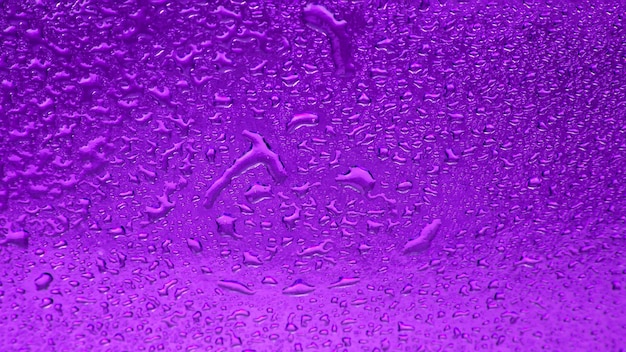 Drops of water on a colored background Abstract texture