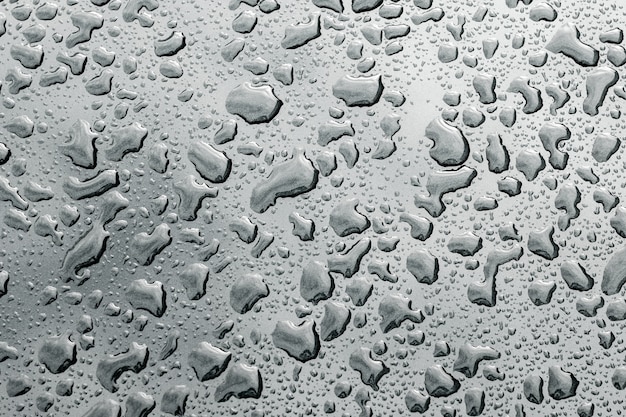 Drops of water on the surface. Abstract photo as background.