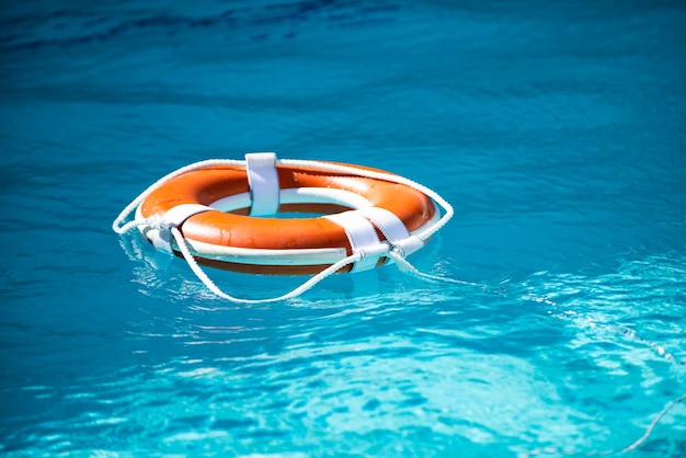 Drowning in water catch lifebuoy safety and urgent help resque needed life buoy floating in pool