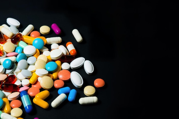 Drug or medicine pills on the table in a dark background