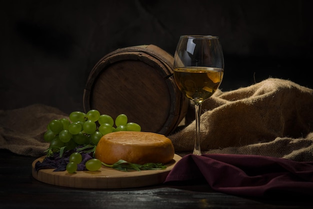 Drum a glass of wine on a dark background