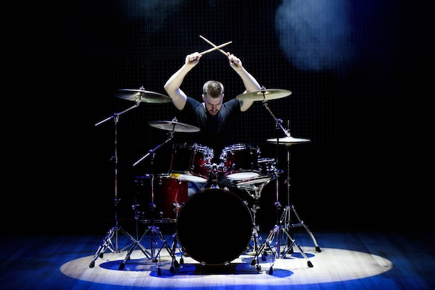 Drummer playing the drums on stage