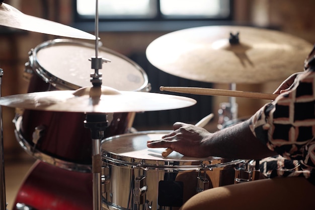 Drummer playing rock music at studio