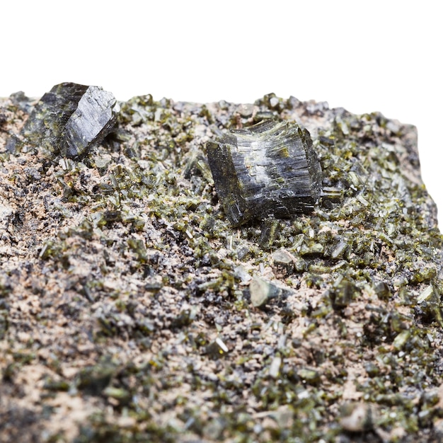 Druse of green epidote crystals close up on rock