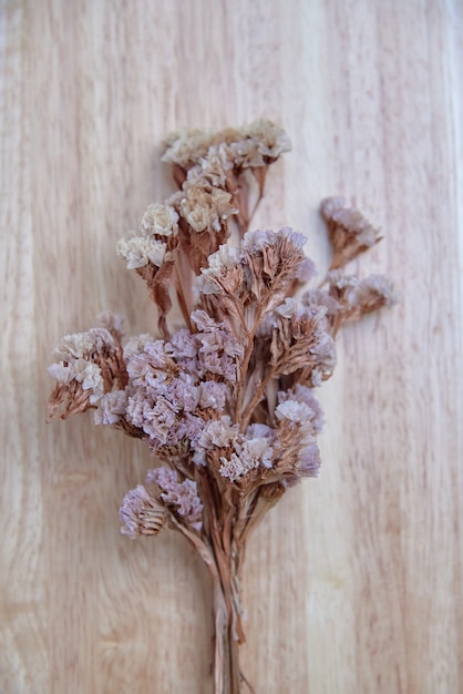 Dry flower on the wooden board