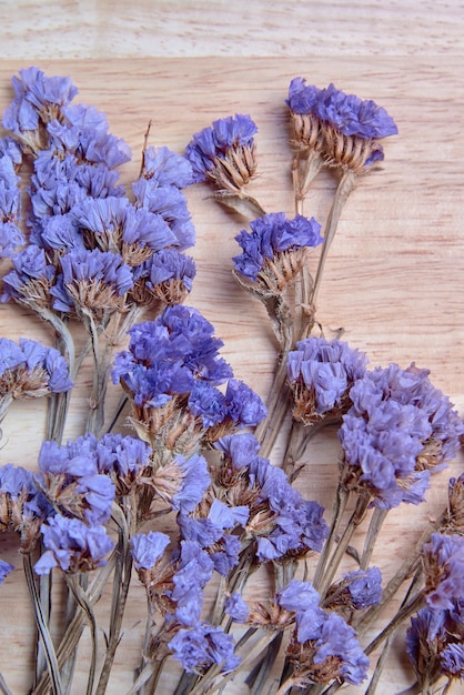 Dry flower on the wooden board