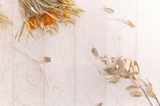 Dry flowers on wooden table season background