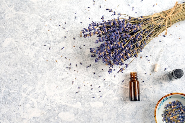 Dry Lavender bunch with essentials oils isolated on white background