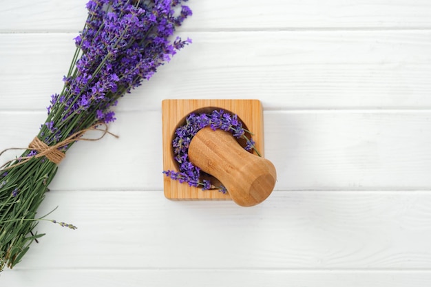 Dry lavender flowers on wooden background close up