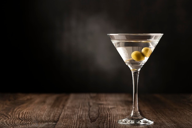 Dry martini drink with green olives