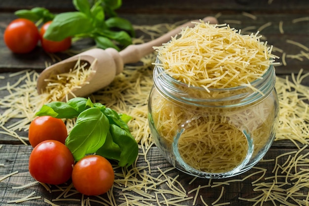 Dry pasta vermicelli cherry tomatoes basil