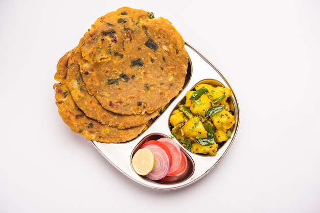 Dry Potato Vegetable fry recipe with Onion or Pyaj Paratha, served with mango pickle or achar. Indian food