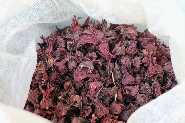 Dry Roselle flowers in white bag. Herb for make healthy drink and chinese medicine.