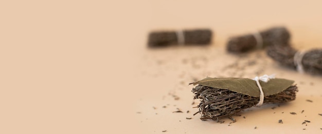 Dry seasoning herbs tied in bunches on a light background Banner