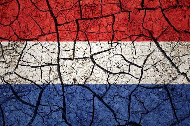 Dry soil pattern on the flag of Netherlands. Country with drought concept. Water problem.