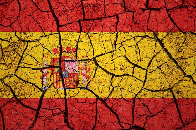 Dry soil pattern on the flag of Spain. Country with drought concept. Water problem.