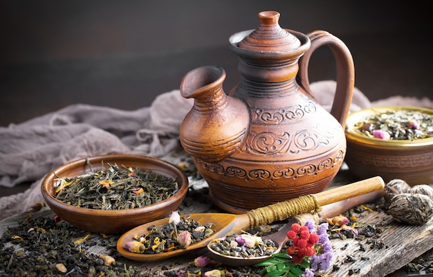 Dry tea leaves on a table on an old background