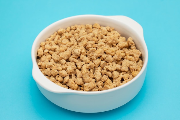 Dry uncooked soya in white small bowl