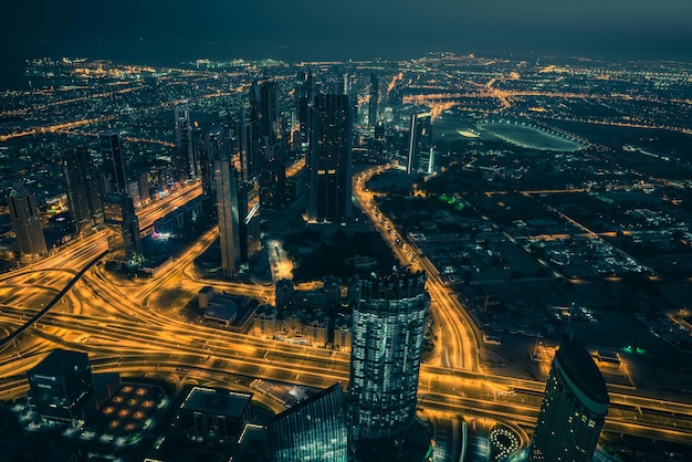 Dubai downtown night scene with city lights Top view from above