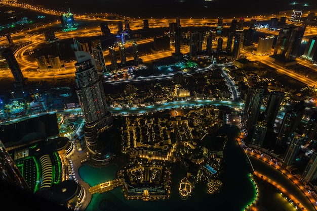 Dubai downtown night scene with city lights Top view