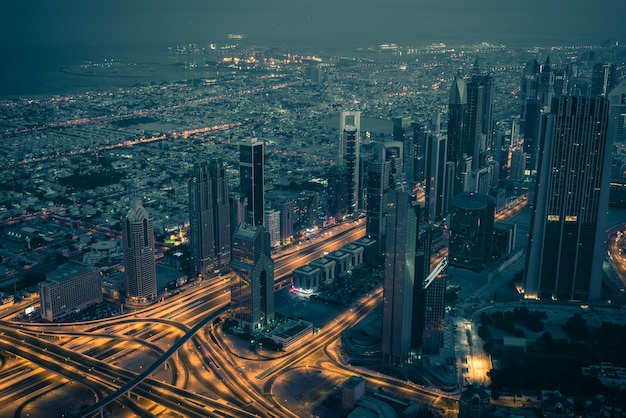 Dubai downtown night scene with city lights