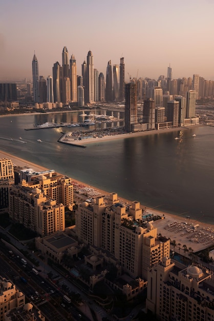 Dubai skyline on sunset modern city with skyscrapers