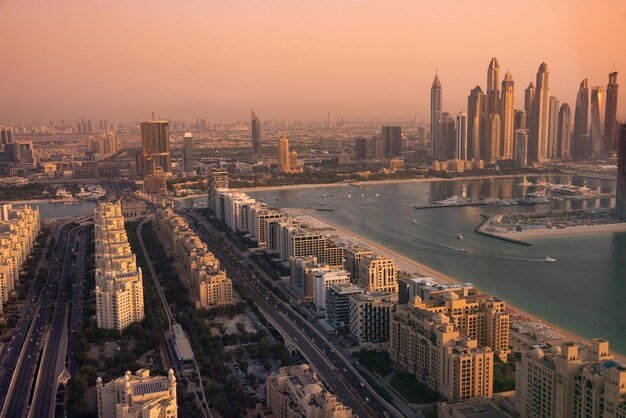 Dubai skyline on sunset modern city with skyscrapers